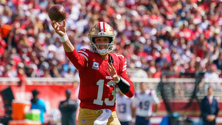 Sep 29, 2024; Santa Clara, California, USA; San Francisco 49ers quarterback Brock Purdy (13) passes the football against the New England Patriots during the first quarter at Levi's Stadium. Mandatory Credit: Neville E. Guard-Imagn Images