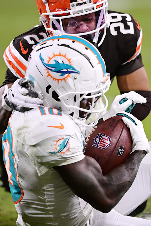 Cleveland Browns cornerback Cameron Mitchell tackles Miami Dolphins wide receiver Tyreek Hill.