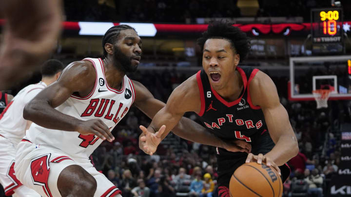 Nov 7, 2022; Chicago, Illinois, USA; Toronto Raptors forward Scottie Barnes (4) is defended by Chicago Bulls forward Patrick Williams (44) during the second half at United Center. Mandatory Credit: David Banks-USA TODAY Sports