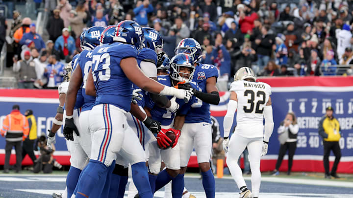 Dec 8, 2024; East Rutherford, New Jersey, USA; New York Giants wide receiver Malik Nabers (1) celebrates his two-point conversion against the New Orleans Saints with teammates during the fourth quarter at MetLife Stadium. Dec 8, 2024; East Rutherford, New Jersey, USA; New York Giants wide receiver Malik Nabers (1) celebrates his two-point conversion against the New Orleans Saints with teammates during the fourth quarter at MetLife Stadium.
