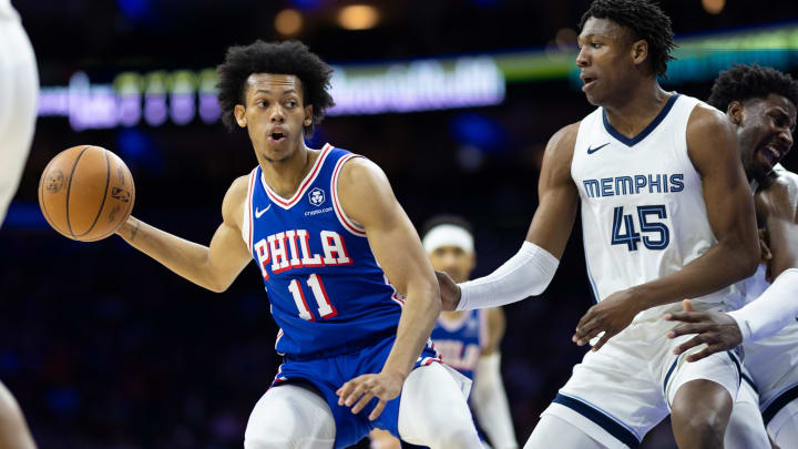 Mar 6, 2024; Philadelphia, Pennsylvania, USA; Philadelphia 76ers guard Jeff Dowtin Jr. (11) controls the ball against Memphis Grizzlies forward GG Jackson (45) during the first quarter at Wells Fargo Center. Mandatory Credit: Bill Streicher-USA TODAY Sports