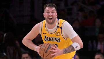 Feb 10, 2025; Los Angeles, California, USA; Los Angeles Lakers guard Luka Doncic (77) looks to make a long pass down court in the first half against the Utah Jazz at Crypto.com Arena. Mandatory Credit: Jayne Kamin-Oncea-Imagn Images