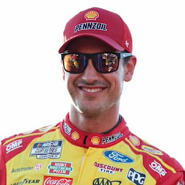 Aug 16, 2025; Richmond, Virginia, USA; NASCAR Cup Series driver Joey Logano (22) smiles during driver introductions prior to the NASCAR Cup Series Cook Out 400 at Richmond Raceway. Mandatory Credit: Amber Searls-Imagn Images