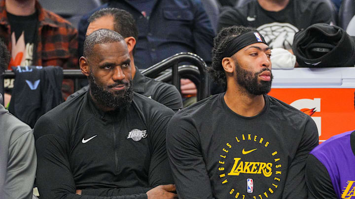 Dec 2, 2024; Minneapolis, Minnesota, USA; Los Angeles Lakers forward LeBron James (23) and forward Anthony Davis (3) on the bench against the Minnesota Timberwolves in the fourth quarter at Target Center. Mandatory Credit: Brad Rempel-Imagn Images
