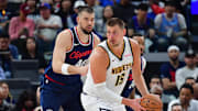 Apr 24, 2025; Inglewood, California, USA; Denver Nuggets center Nikola Jokic (15) controls the ball against Los Angeles Clippers center Ivica Zubac (40) during the second half of game three in the first round for the 2024 NBA Playoffs at Intuit Dome. Mandatory Credit: Gary A. Vasquez-Imagn Images