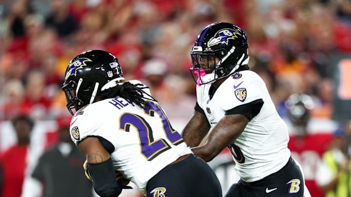 Oct 21, 2024; Tampa, Florida, USA; Baltimore Ravens quarterback Lamar Jackson (8) hands off to running back Derrick Henry (22) against the Tampa Bay Buccaneers in the first quarter at Raymond James Stadium. Mandatory Credit: Nathan Ray Seebeck-Imagn Images Oct 21, 2024; Tampa, Florida, USA; Baltimore Ravens quarterback Lamar Jackson (8) hands off to running back Derrick Henry (22) against the Tampa Bay Buccaneers in the first quarter at Raymond James Stadium. Mandatory Credit: Nathan Ray Seebeck-Imagn Images
