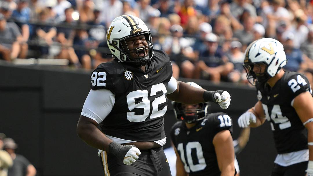 Sep 27, 2025; Nashville, Tennessee, USA;  Vanderbilt Commodores defensive lineman Jaylon Stone (92) celebrates the sack of Utah State Aggies quarterback Bryson Barnes (16) during the first half at FirstBank Stadium. Mandatory Credit: Steve Roberts-Imagn Images