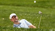 Jun 9, 2024; Dublin, Ohio, USA; Scottie Scheffler hits from a bunker on the fourth hole during the final round of the Memorial Tournament at Muirfield Village Golf Club. Mandatory Credit: Adam Cairns-Imagn Images