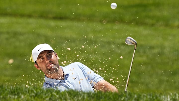 Jun 9, 2024; Dublin, Ohio, USA; Scottie Scheffler hits from a bunker on the fourth hole during the final round of the Memorial Tournament at Muirfield Village Golf Club. Mandatory Credit: Adam Cairns-Imagn Images Jun 9, 2024; Dublin, Ohio, USA; Scottie Scheffler hits from a bunker on the fourth hole during the final round of the Memorial Tournament at Muirfield Village Golf Club. Mandatory Credit: Adam Cairns-Imagn Images