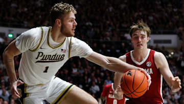 Purdue senior forward Caleb Furst grabs the basketball