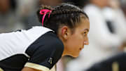 Purdue setter Taylor Anderson (5) prepares to defend a serve 