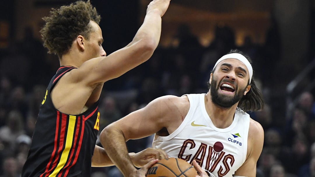 Apr 8, 2026; Cleveland, Ohio, USA; Atlanta Hawks guard Dyson Daniels (5) defends Cleveland Cavaliers guard Max Strus (2) in the third quarter at Rocket Arena. Mandatory Credit: David Richard-Imagn Images