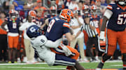 Sep 6, 2025; Syracuse, New York, USA; UConn Huskies linebacker Bryun Parham (6) sacks Syracuse Orange quarterback Steve Angeli (9) during the second half at JMA Wireless Dome. Mandatory Credit: Gregory Fisher-Imagn Images