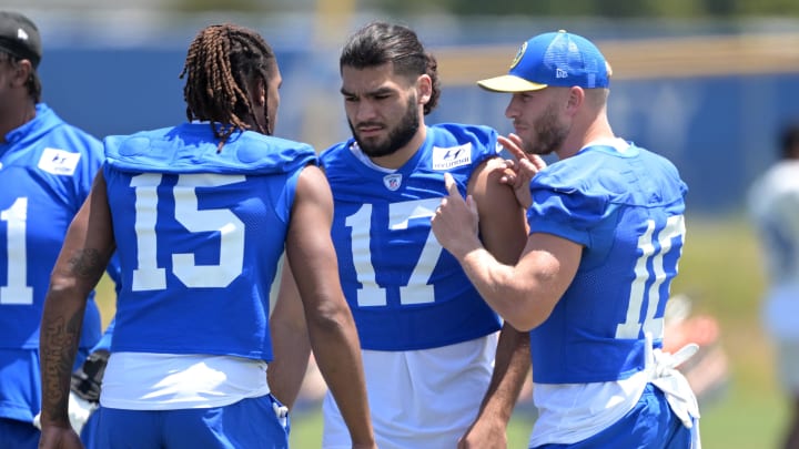 May 28, 2024; Thousand Oaks, CA, USA; Los Angeles Rams wide receiver Demarcus Robinson (15), wide receiver Puka Nacua (17) and wide receiver Cooper Kupp (10) talk during OTAs at California Lutheran University. Mandatory Credit: Jayne Kamin-Oncea-USA TODAY Sports