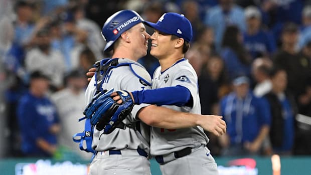 Los Angeles Dodgers pitcher Yoshinobu Yamamoto (18) and catcher Will Smith