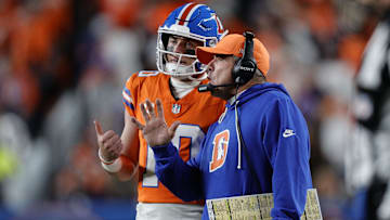Nov 6, 2025; Denver, Colorado, USA; Denver Broncos head coach Sean Payton talks with quarterback Bo Nix (10) during the second half at Empower Field at Mile High. 