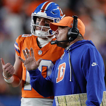 Nov 6, 2025; Denver, Colorado, USA; Denver Broncos head coach Sean Payton talks with quarterback Bo Nix (10) during the second half at Empower Field at Mile High. 