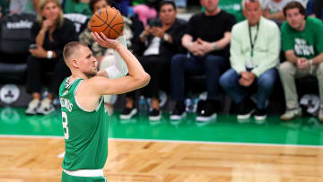 Jun 17, 2024; Boston, Massachusetts, USA; Boston Celtics center Kristaps Porzingis (8) shoots the ball against the Dallas Mavericks in game five of the 2024 NBA Finals at TD Garden. Mandatory Credit: Peter Casey-USA TODAY Sports