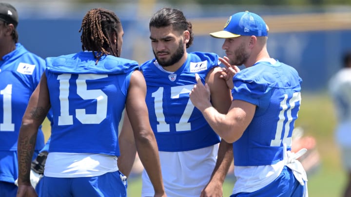 May 28, 2024; Thousand Oaks, CA, USA; Los Angeles Rams wide receiver Demarcus Robinson (15), wide receiver Puka Nacua (17) and wide receiver Cooper Kupp (10) talk during OTAs at California Lutheran University. Mandatory Credit: Jayne Kamin-Oncea-USA TODAY Sports