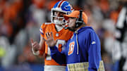 Nov 6, 2025; Denver, Colorado, USA; Denver Broncos head coach Sean Payton talks with quarterback Bo Nix (10) during the second half at Empower Field at Mile High.