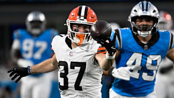  Cleveland Browns wide receiver Luke Floriea (37) with a fingertip catch as Carolina Panthers linebacker Jon Rhattigan (49) defends in the second quarter at Bank of America Stadium.