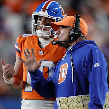 Nov 6, 2025; Denver, Colorado, USA; Denver Broncos head coach Sean Payton talks with quarterback Bo Nix (10) during the second half at Empower Field at Mile High. 