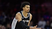 Dec 23, 2024; Philadelphia, Pennsylvania, USA; San Antonio Spurs center Victor Wembanyama (1) reacts to his three pointer against the Philadelphia 76ers during the second quarter at Wells Fargo Center. Mandatory Credit: Bill Streicher-Imagn Images