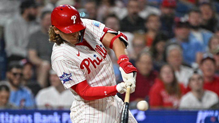 Apr 13, 2026; Philadelphia, Pennsylvania, USA; Philadelphia Phillies third baseman Alec Bohm (28) hits an RBI single against the Chicago Cubs during the fifth inning at Citizens Bank Park. Mandatory Credit: Eric Hartline-Imagn Images