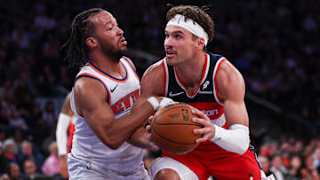 Oct 9, 2024; New York, New York, USA; Washington Wizards forward Corey Kispert (24) is defended by New York Knicks guard Jalen Brunson (11) during the first quarter at Madison Square Garden. Mandatory Credit: Vincent Carchietta-Imagn Images