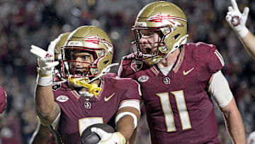 Oct 5, 2024; Tallahassee, Florida, USA; Florida State Seminoles wide receiver Ja'Khi Douglas (0) celebrates with quarterback Brock Glenn (11) after a touchdown against the Clemson Tigers during the second half at Doak S. Campbell Stadium. Mandatory Credit: Melina Myers-Imagn Images
