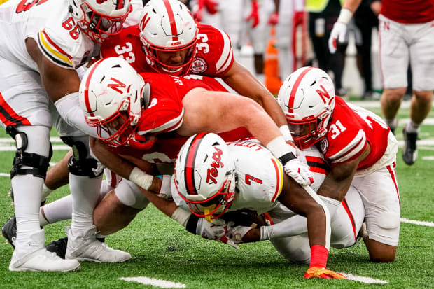 Maryland Terrapins running back Antwain Littleton II (7) is stopped short of a first down on a fourth down play by Nebraska