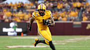 Aug 28, 2025; Minneapolis, Minnesota, USA; Minnesota Golden Gophers running back Darius Taylor (1) runs the ball against the Buffalo Bulls during the first half of the game at Huntington Bank Stadium. Mandatory Credit: Matt Krohn-Imagn Images