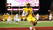 Aug 28, 2025; Minneapolis, Minnesota, USA; Minnesota Golden Gophers wide receiver Jalen Smith (8) runs the ball after a catch for a touchdown against the Buffalo Bulls during the second half of the game at Huntington Bank Stadium. Mandatory Credit: Matt Krohn-Imagn Images