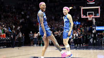 Minnesota Lynx guard Courtney Williams (10) and guard Natisha Hiedeman (2) celebrate their teams win against the New York Liberty after the game at Target Center. 