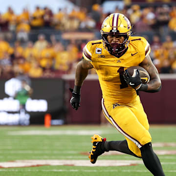 Aug 28, 2025; Minneapolis, Minnesota, USA; Minnesota Golden Gophers running back Darius Taylor (1) runs the ball against the Buffalo Bulls during the first half of the game at Huntington Bank Stadium. Mandatory Credit: Matt Krohn-Imagn Images