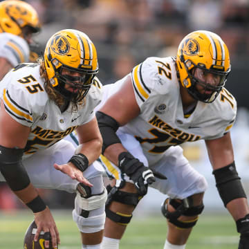 Sep 30, 2023; Nashville, Tennessee, USA; Missouri Tigers offensive lineman Connor Tollison (55) snaps the ball against the Vanderbilt Commodores during the second half at FirstBank Stadium.