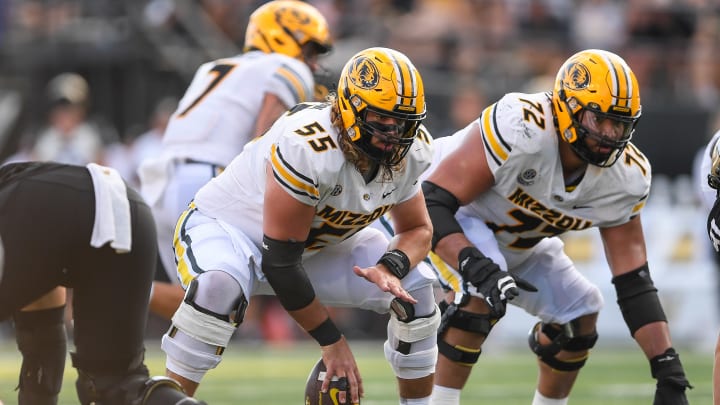 Sep 30, 2023; Nashville, Tennessee, USA; Missouri Tigers offensive lineman Connor Tollison (55) snaps the ball against the Vanderbilt Commodores during the second half at FirstBank Stadium.