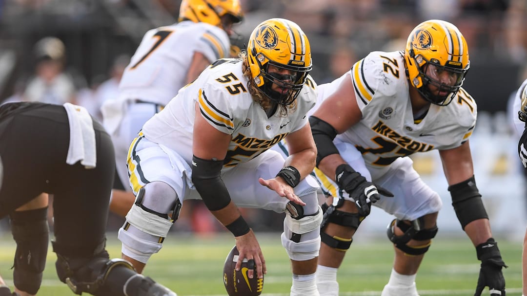 Missouri Tigers offensive lineman Connor Tollison (55) snaps the ball, in a game against the Vanderbilt Commodores last season.