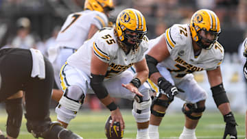 Missouri Tigers offensive lineman Connor Tollison (55) snaps the ball, in a game against the Vanderbilt Commodores last season.