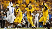Aug 28, 2025; Minneapolis, Minnesota, USA; Minnesota Golden Gophers wide receiver Javon Tracy (11) runs after a catch against the Buffalo Bulls during the second half of the game at Huntington Bank Stadium. Mandatory Credit: Matt Krohn-Imagn Images