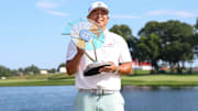 Kurt Kitayama celebrates with the trophy after winning the 3M Open golf tournament. Mandatory Credit: Matt Krohn-Imagn Images