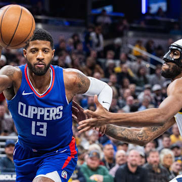 Dec 18, 2023; Indianapolis, Indiana, USA;  LA Clippers forward Paul George (13) dribbles the ball while Indiana Pacers forward Isaiah Jackson (22) defends in the first quarter at Gainbridge Fieldhouse. Mandatory Credit: Trevor Ruszkowski-Imagn Images