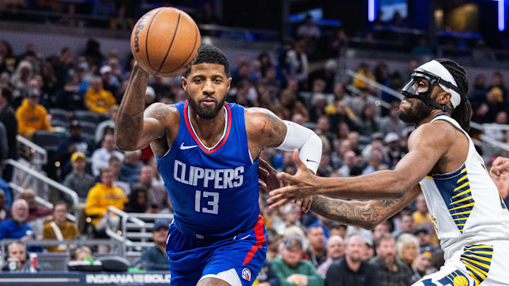 Dec 18, 2023; Indianapolis, Indiana, USA;  LA Clippers forward Paul George (13) dribbles the ball while Indiana Pacers forward Isaiah Jackson (22) defends in the first quarter at Gainbridge Fieldhouse. Mandatory Credit: Trevor Ruszkowski-Imagn Images