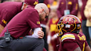 Sep 6, 2025; Minneapolis, Minnesota, USA; Minnesota Golden Gophers running back Darius Taylor (1) is looked at by training staff during the first quarter against the Northwestern State Demons at Huntington Bank Stadium. Mandatory Credit: Matt Krohn-Imagn Images