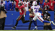 Tampa Bay Buccaneers' running back Sean Tucker (44) and Buffalo Bills cornerback Maxwell Hairston (31).