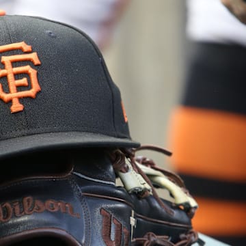 Jul 14, 2023; Pittsburgh, Pennsylvania, USA;  San Francisco Giants hat and glove on the bench against the Pittsburgh Pirates during the first inning at PNC Park. 