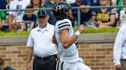 Purdue Boilermakers quarterback Ryan Browne (15) scores against the Notre Dame Fighting Irish 