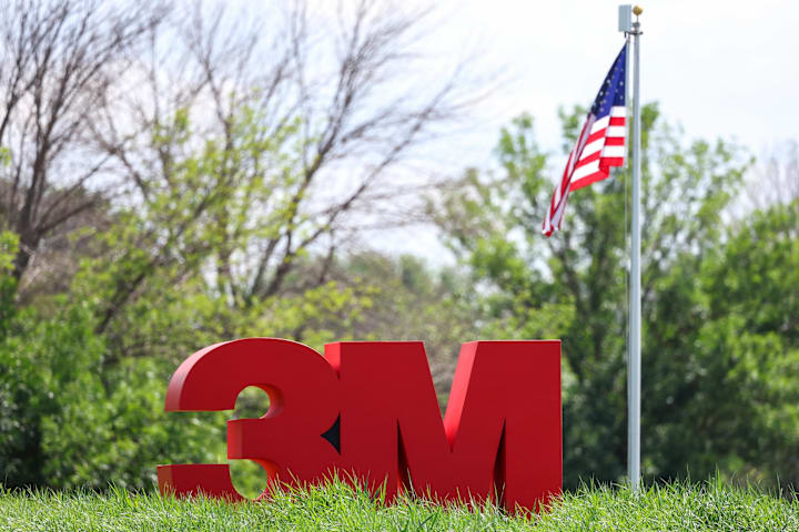 A view of a 3M Open sign during the first round of the 3M Open golf tournament. 
