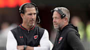 Wisconsin head coach Luke Fickell talks with outside linebackers coach Matt Mitchell during the game against Middle Tennessee