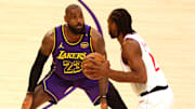 Feb 28, 2025; Los Angeles, California, USA; Los Angeles Lakers forward LeBron James (23) defends LA Clippers forward Kawhi Leonard (2) during the first quarter at Crypto.com Arena. Mandatory Credit: Jason Parkhurst-Imagn Images